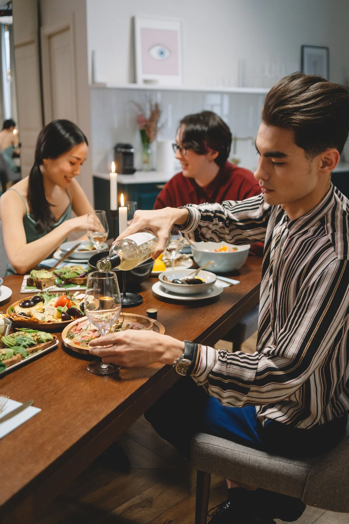 Friends sharing food and conversation around a dinner table